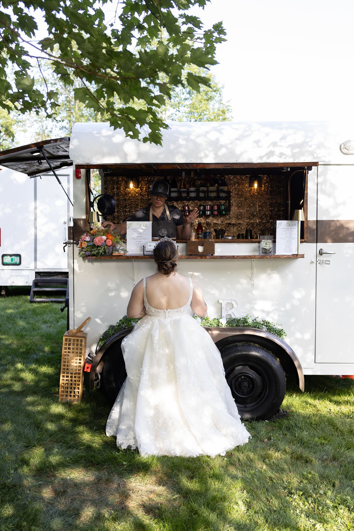 A bride ordering a drink at the Parlor Car bar
