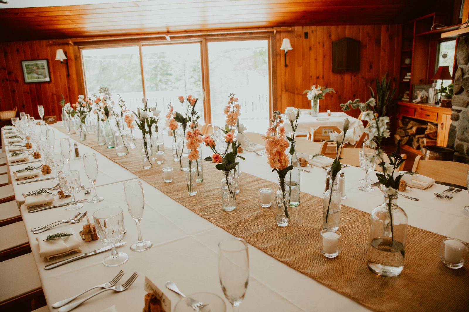 A reception table set with florals and candles, planned by Perfectly Planned