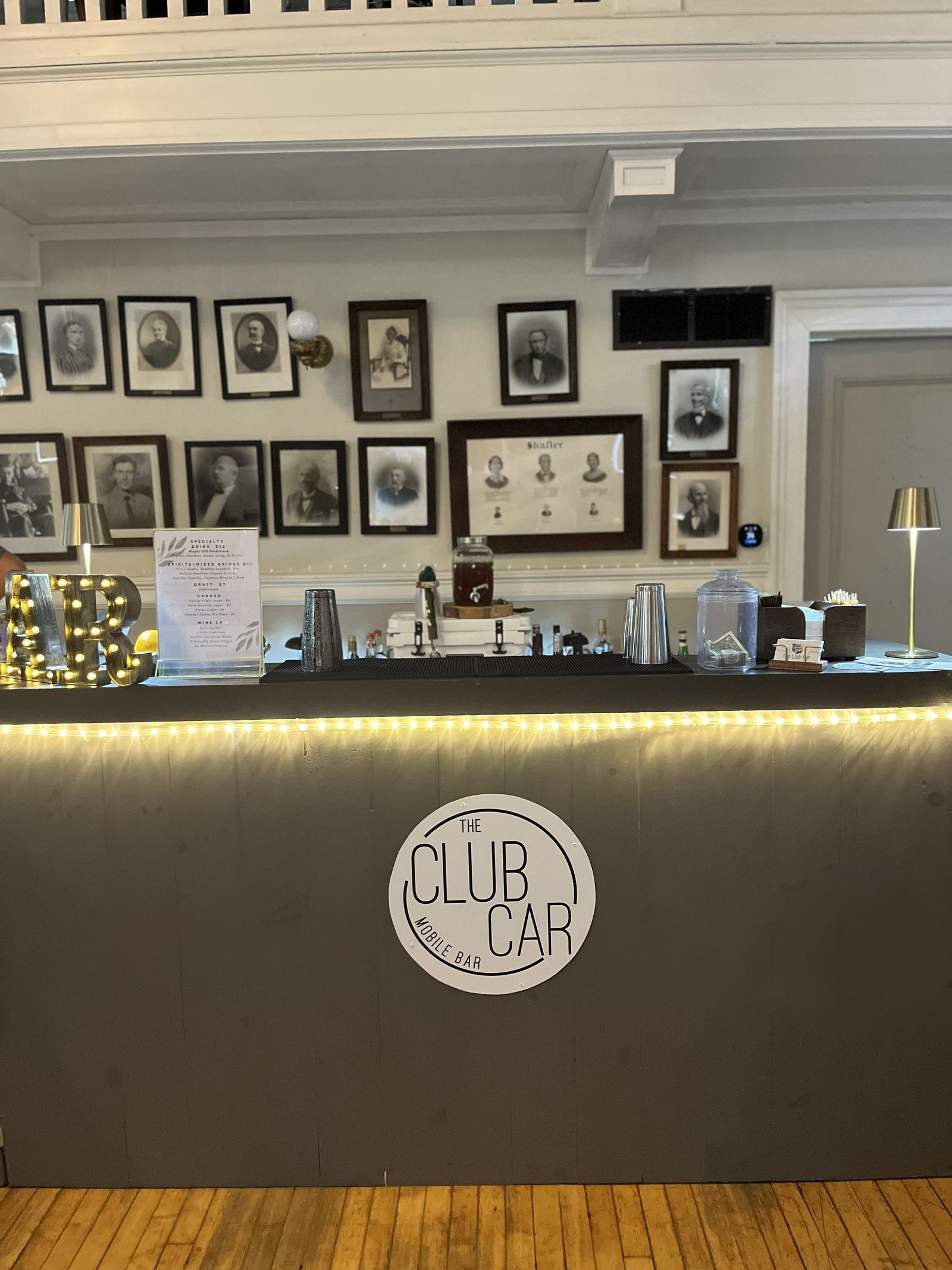 Portable Club Car bar set up indoors for a reception